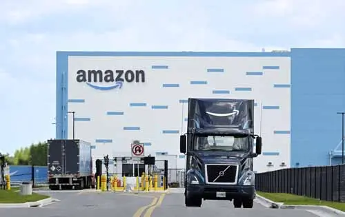 Amazon is a marketplace for auto parts. Grow your sales with an Amazon Advertising Agency: picture of truck at Amazon warehouse