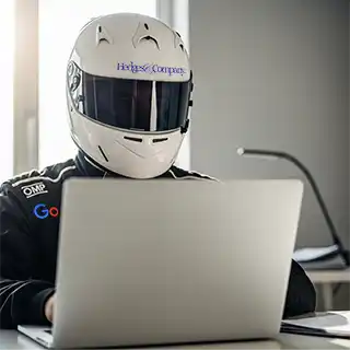 racer in helmet at laptop computer, AI generated and human edited